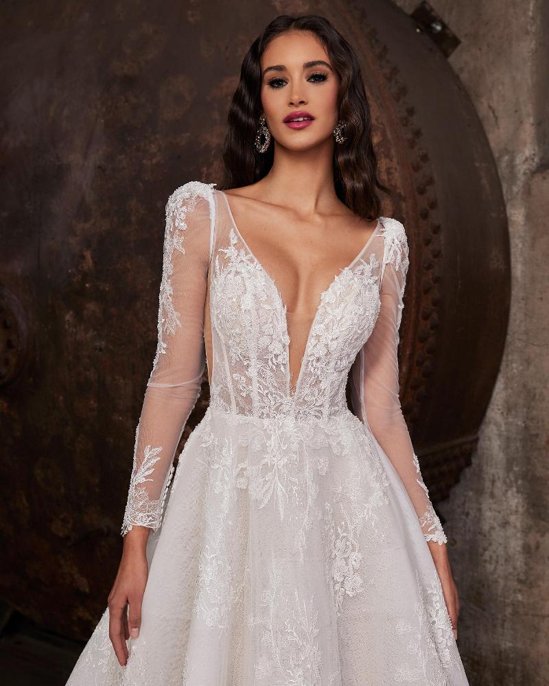 122230 long sleeve lace wedding dress with open back and a line silhouette3